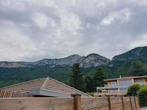 a building with a mountain in the background
